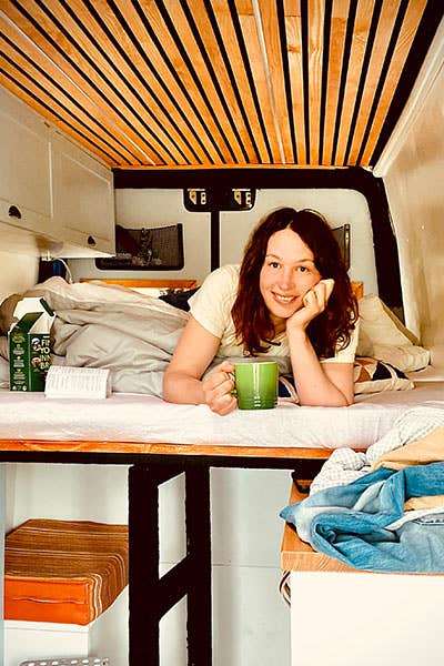Maddy relaxing in the back of the Mercedes Sprinter, once the build was finally finished