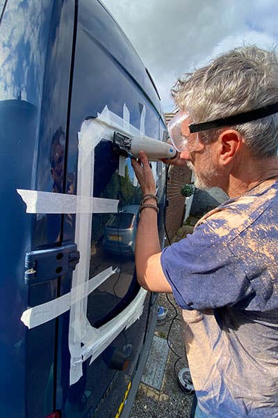 Al from the JK team, installing a set of Just Kampers windows to his Mercedes Sprinter